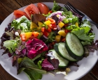 Try our Phoenix Signature Salad - a colorful blend of fresh field greens, cucumbers, purple onions, bell peppers, and tomatoes tossed lightly in one of our homemade dressings.